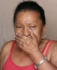 A woman cries during her eviction from Favela do Metrô