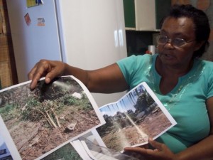 Dona Rita with pictures of the garden
