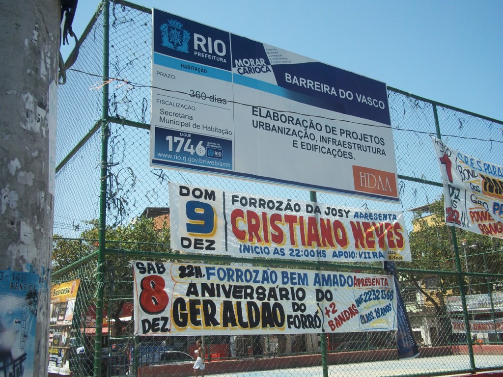 Barreira do Vasco's main square, with sign advertising the community's upgrading