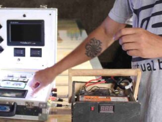 Fábio shows a presentation on his self-designed solar-powered briefcase presentation system