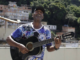 Carlos Augusto Jacob plays guitar on his rooftop on the Tabajaras hill. Photo: Gabriel de Paiva / Agência O Globo