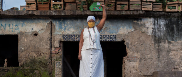 Mãe Ekedi Sílvia de Mendonça, a journalist and a Black Movement activist, in front of the old house of cult of João da Gomeia, one of the most famous candomblé priests of his time. Photo by Bárbara Dias