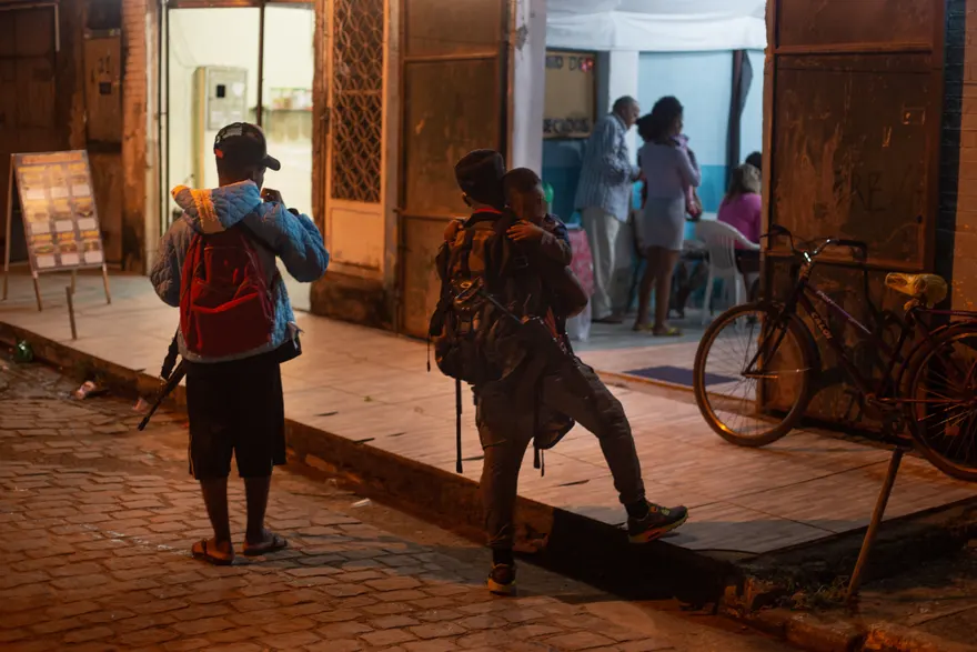 Rifle-toting traffickers watch an Evangelical sermon in Rio's periphery. Photo: Alan Lima/The Guardian