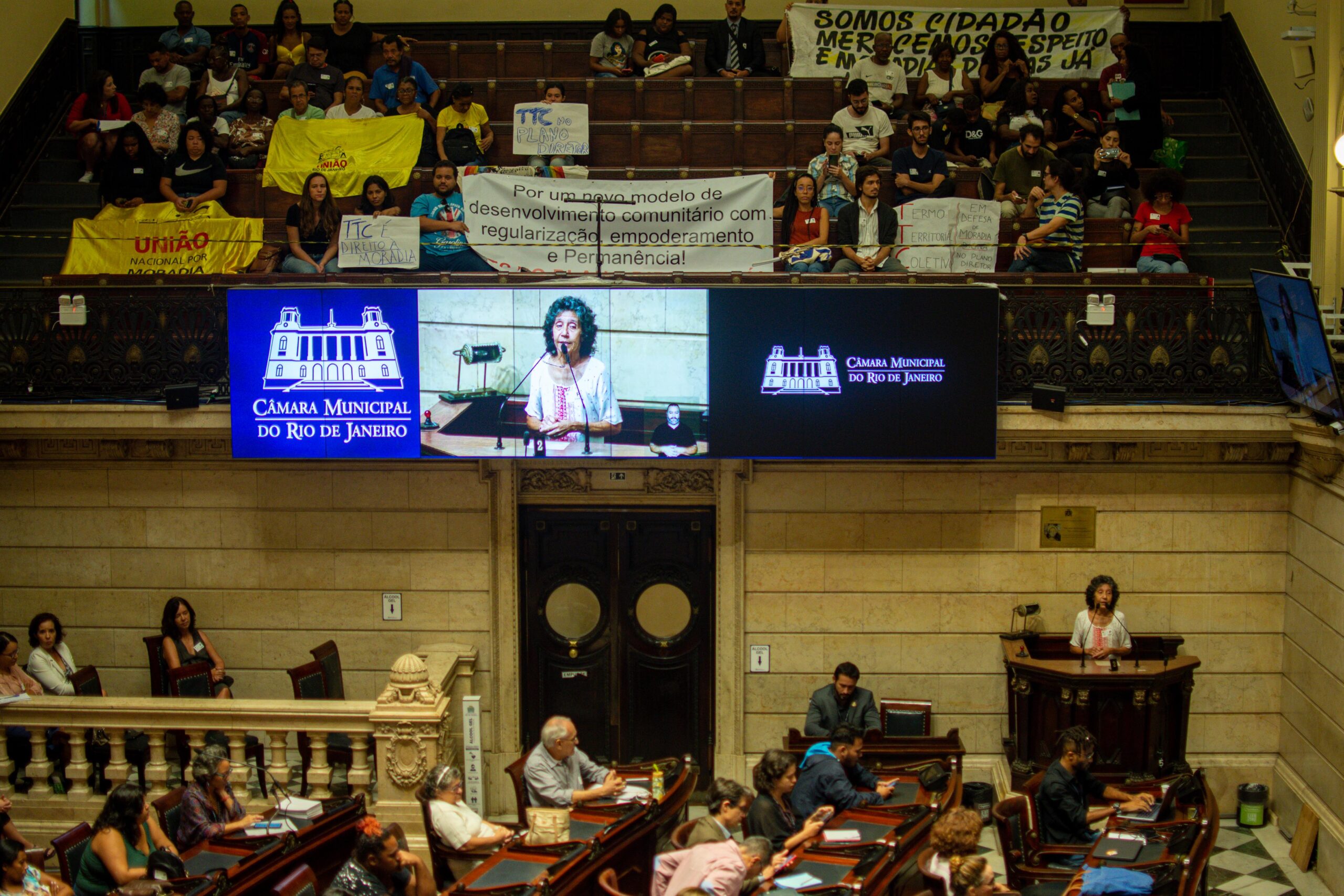 Maria da Penha emphatically defending housing rights at Rio's City Council Chambers on April 12. 