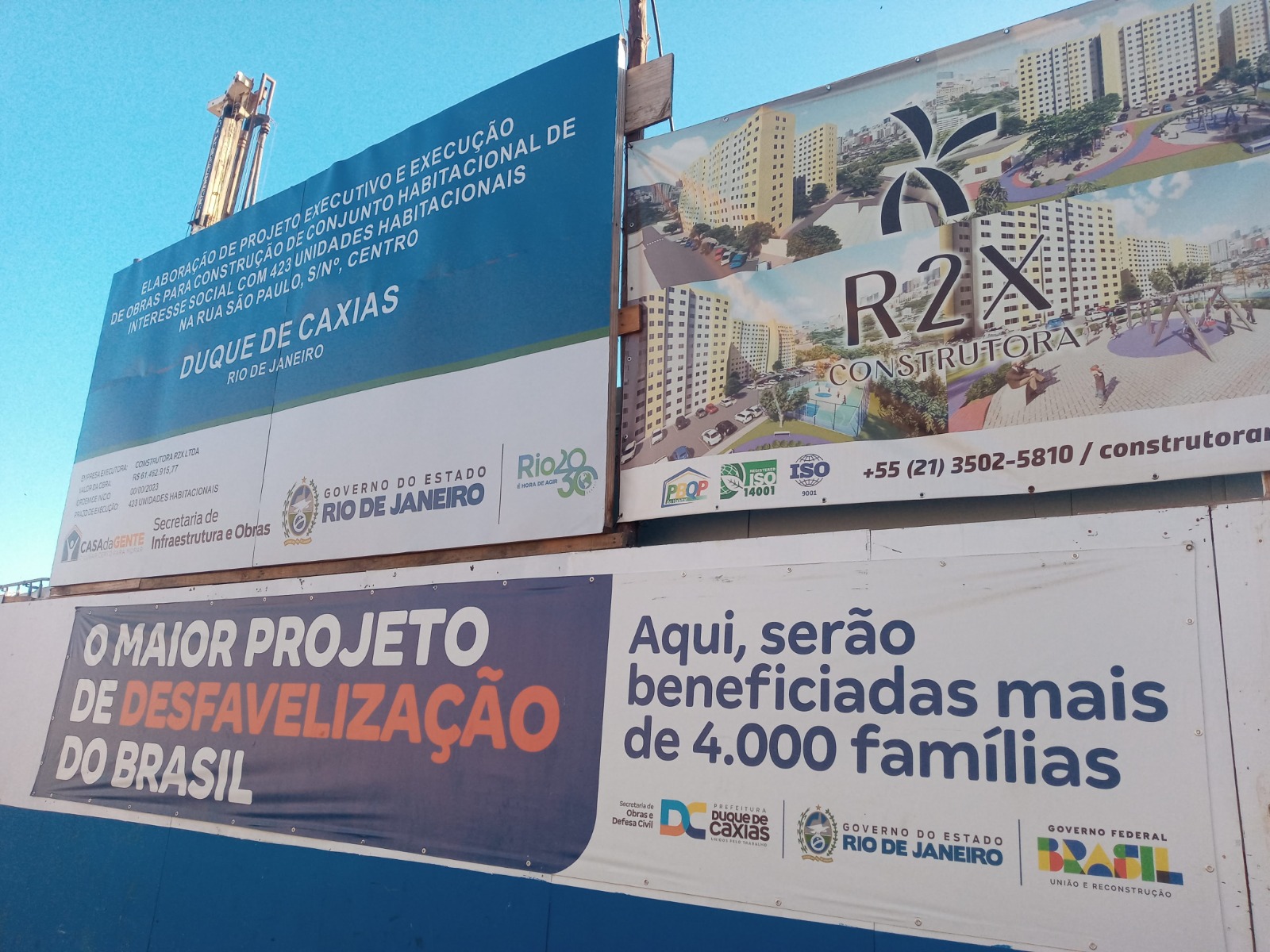 Public-private partnership marketing signs announcing the 'defavelization' of Favela do Lixão. Photo: Fabio Leon