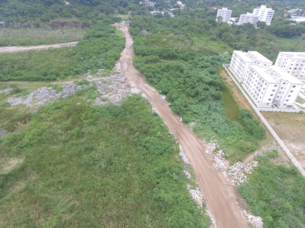 Aerial image of the Campo de Sernambetiba Revis. Dumped waste from real estate development works can be seen in the environmental conservation area. Photo: Living Bay Movement