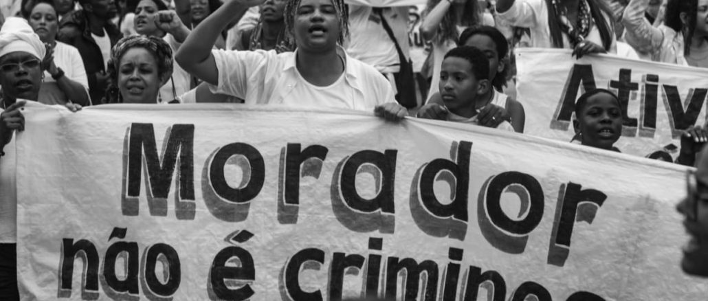 According to one of the recent poll, 87% of Rio's favelas residents supposedly support the police operation that led to the deadliest massacre in Rio de Janeiro's History. Nevertheless, nation-wide favela-led post-massacre protests have shown otherwise. The sign reads 'Resident, Not a Criminal.' Photo: Vinícius Ribeiro