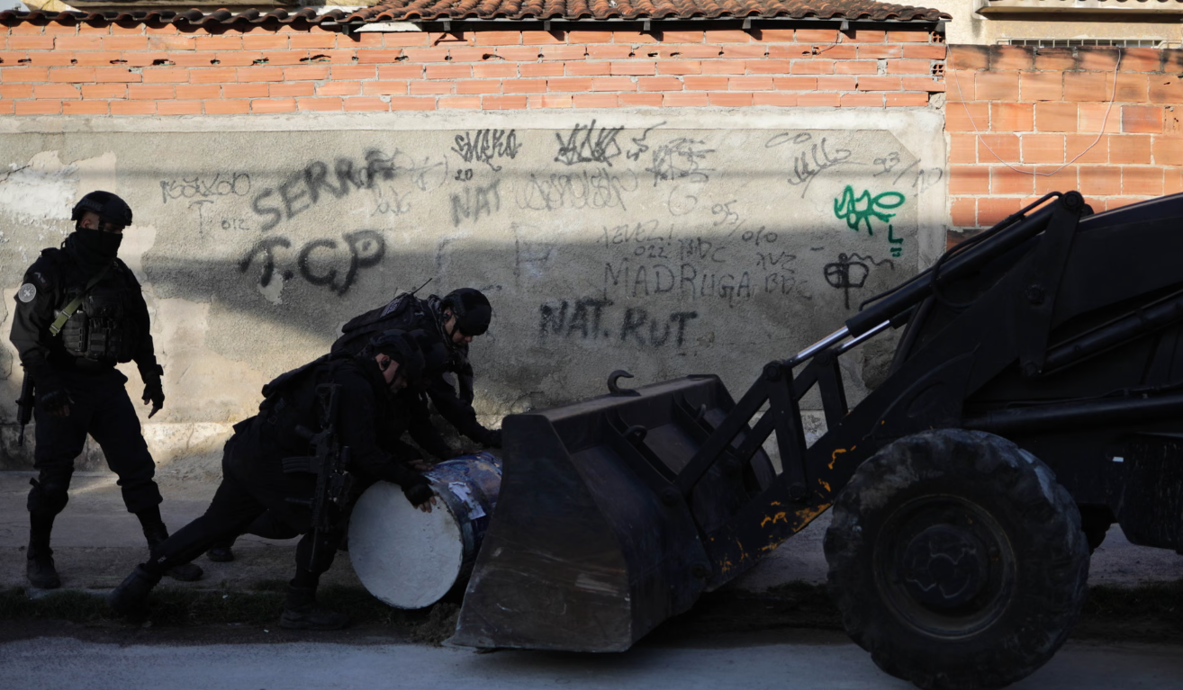Members of Rio's anti-barricade military police team destroy roadblocks built by traffickers. Photograph: Alan Lima/The Guardian Members of Rio's anti-barricade military police team destroy roadblocks built by traffickers. Photograph: Alan Lima/The Guardian