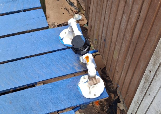 Newly installed water meter in the stilt houses of Vila da Barca is used by the utility to monitor water usage. Residents are charged the social tariff. Photo: CatComm