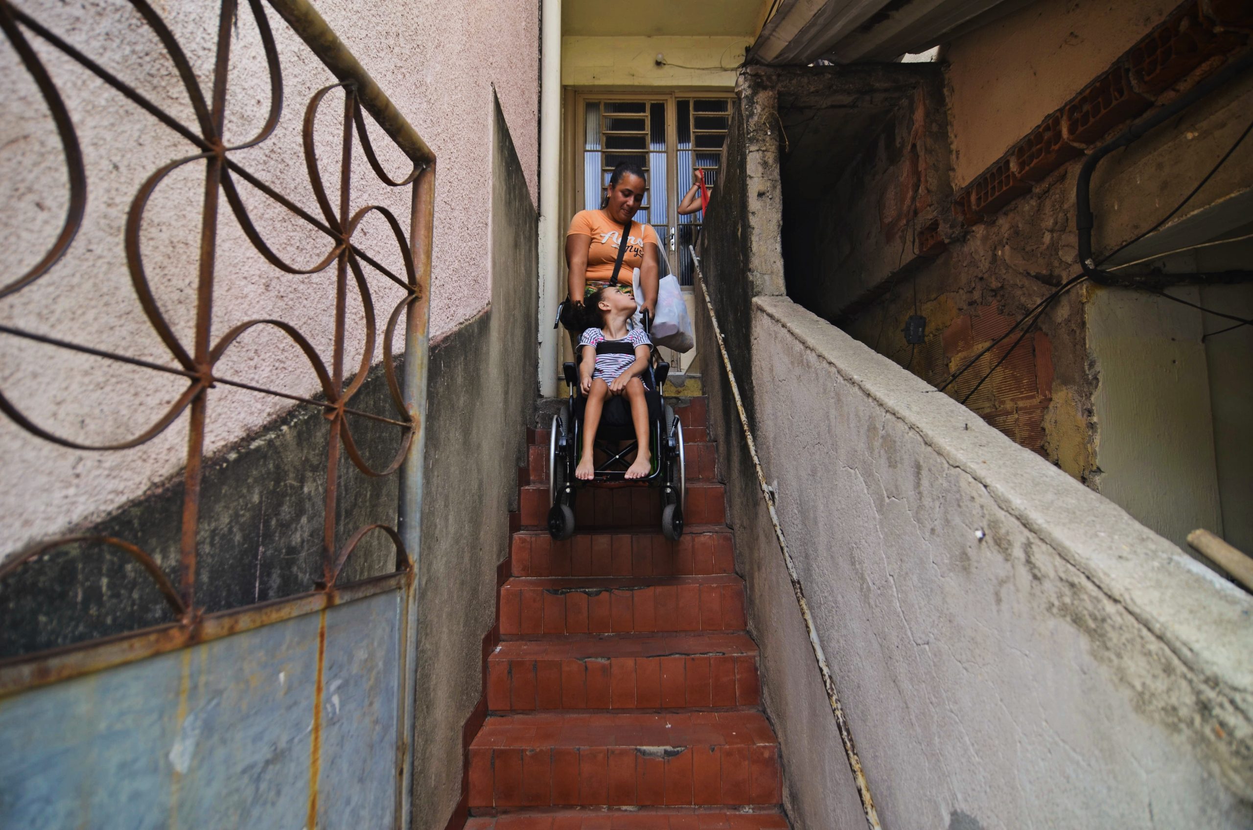 Like Andrade and do Prado, Rocha and her daughter Eloá also live on the second floor. Here, Rocha has to pull the wheelchair up the stairs with her daughter in it to get home. Photo: Ramon Vellasco Like Andrade and do Prado, Rocha and her daughter Eloá also live on the second floor. Here, Rocha has to pull the wheelchair up the stairs with her daughter in it to get home. Photo: Ramon Vellasco